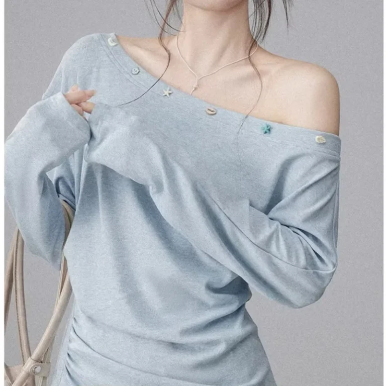 CHINEE-Light-Blue-Off-shoulder-Long-sleeved-T-shirt-for-Women-with-a-Unique-Design-Irregular-Shape-Slim-Fit-and-Pleated-Details